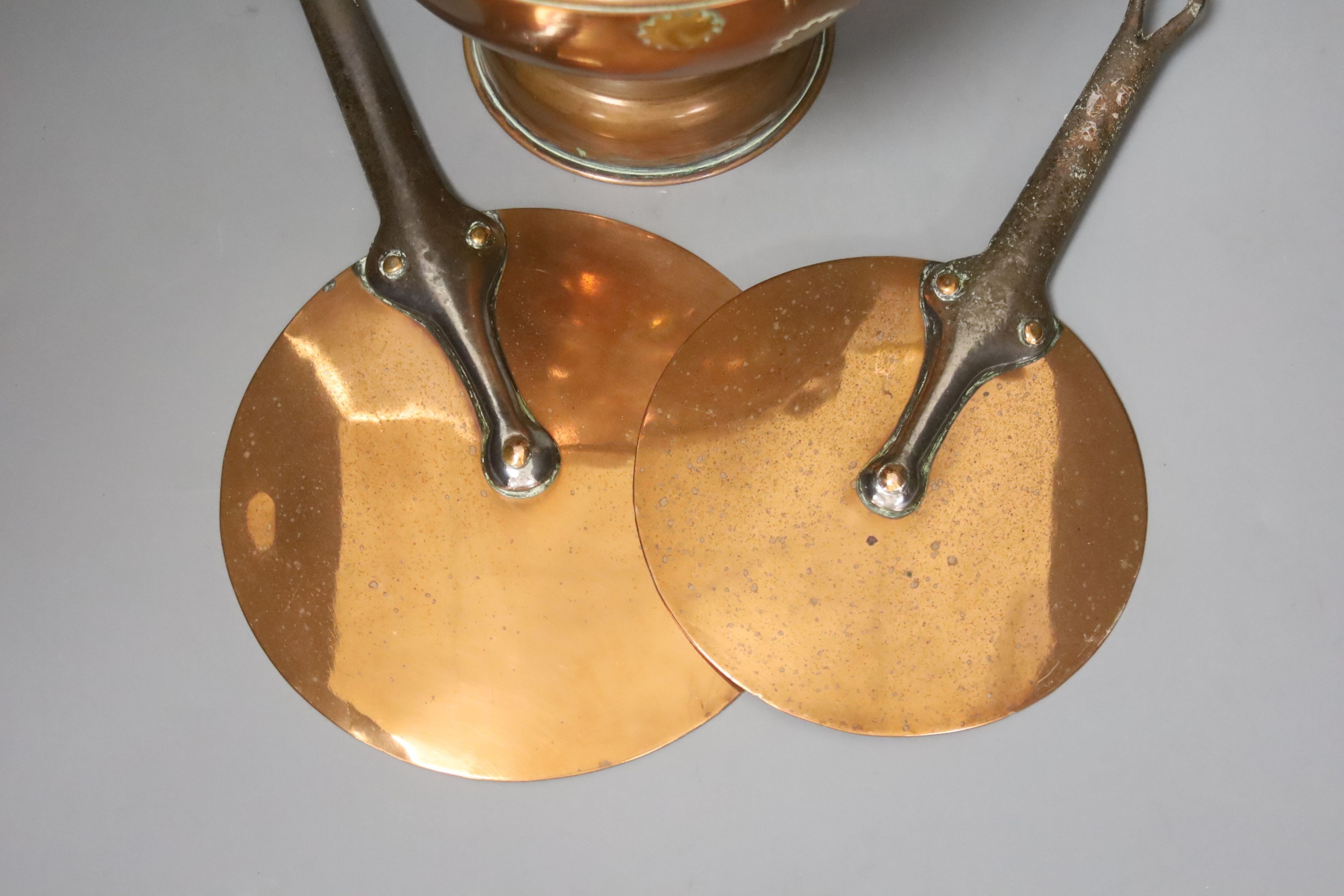 Two Victorian copper saucepan covers and brass-mounted copper kettle